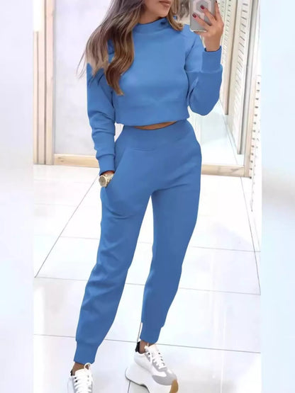 Casual chic cropped sweatshirt and matching joggers from Trendsi, soft fabric, relaxed fit, perfect for stylish loungewear.