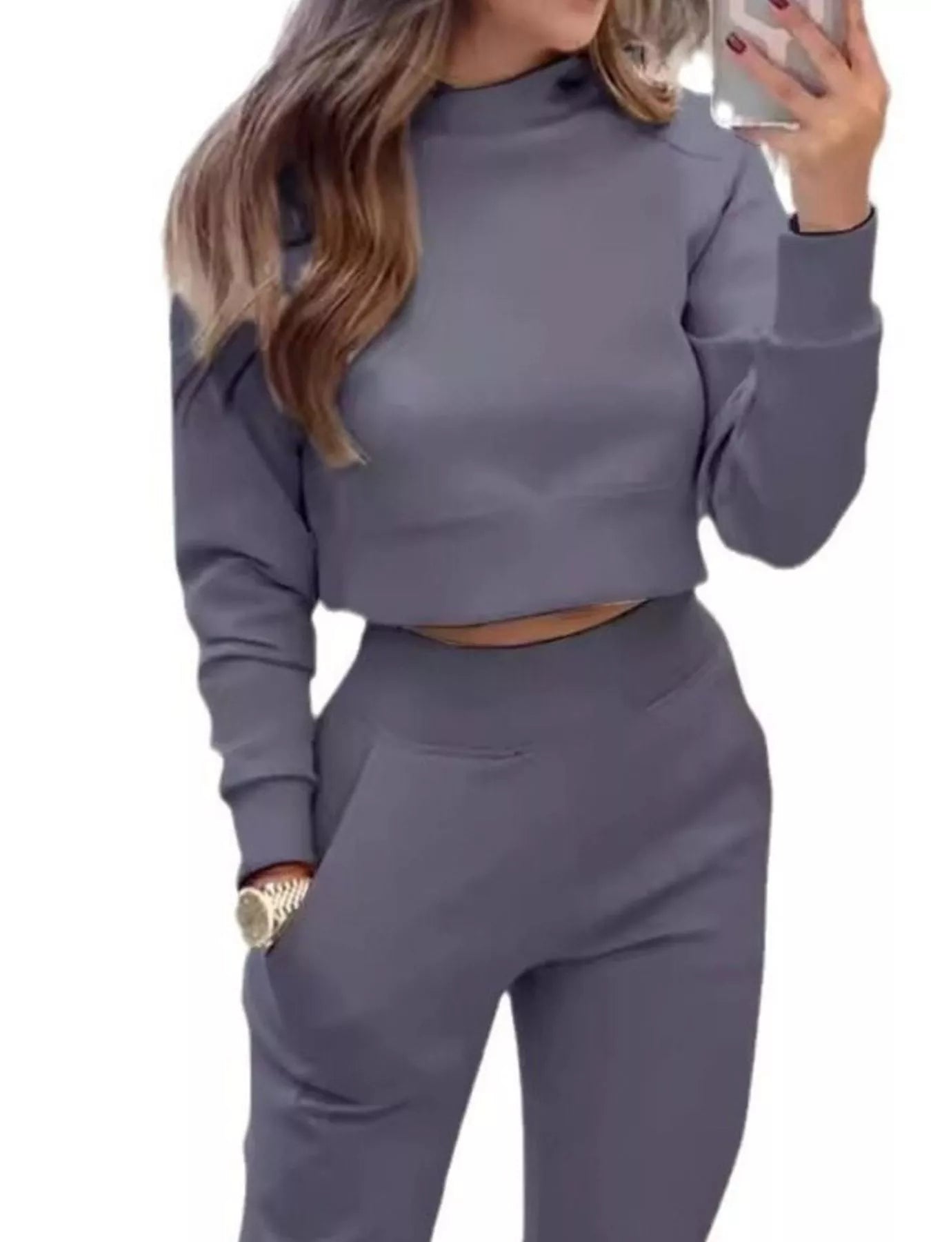 Casual Chic Cropped Sweatshirt and Jogger Set by Trendsi, featuring a relaxed fit with ribbed cuffs and waistband in neutral tones.