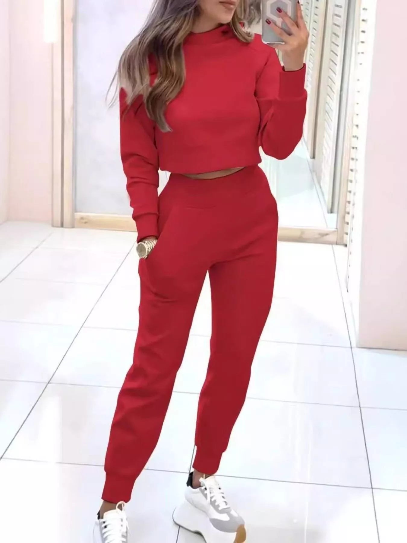 Casual Chic Cropped Sweatshirt and Jogger Set from Trendsi, featuring a comfortable, stylish matching top and pants in neutral fabric.