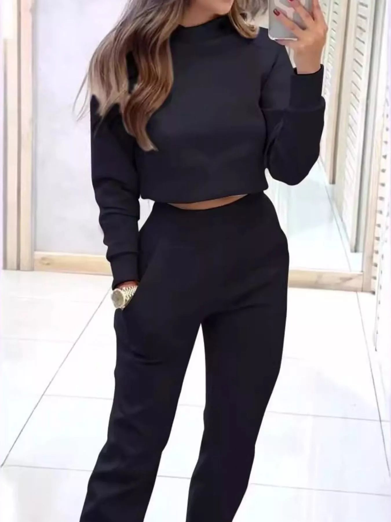 Casual Chic cropped sweatshirt and jogger set by Trendsi, featuring comfortable fabric and modern style in a relaxed fit.