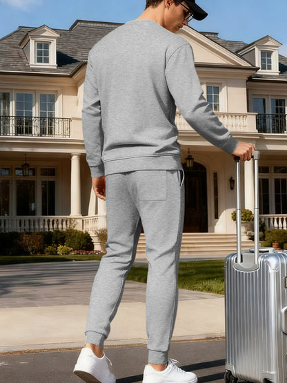 Plus size men's full-size round neck sweatshirt and jogger set by Trendsi in apricot, casual comfortable loungewear ensemble.