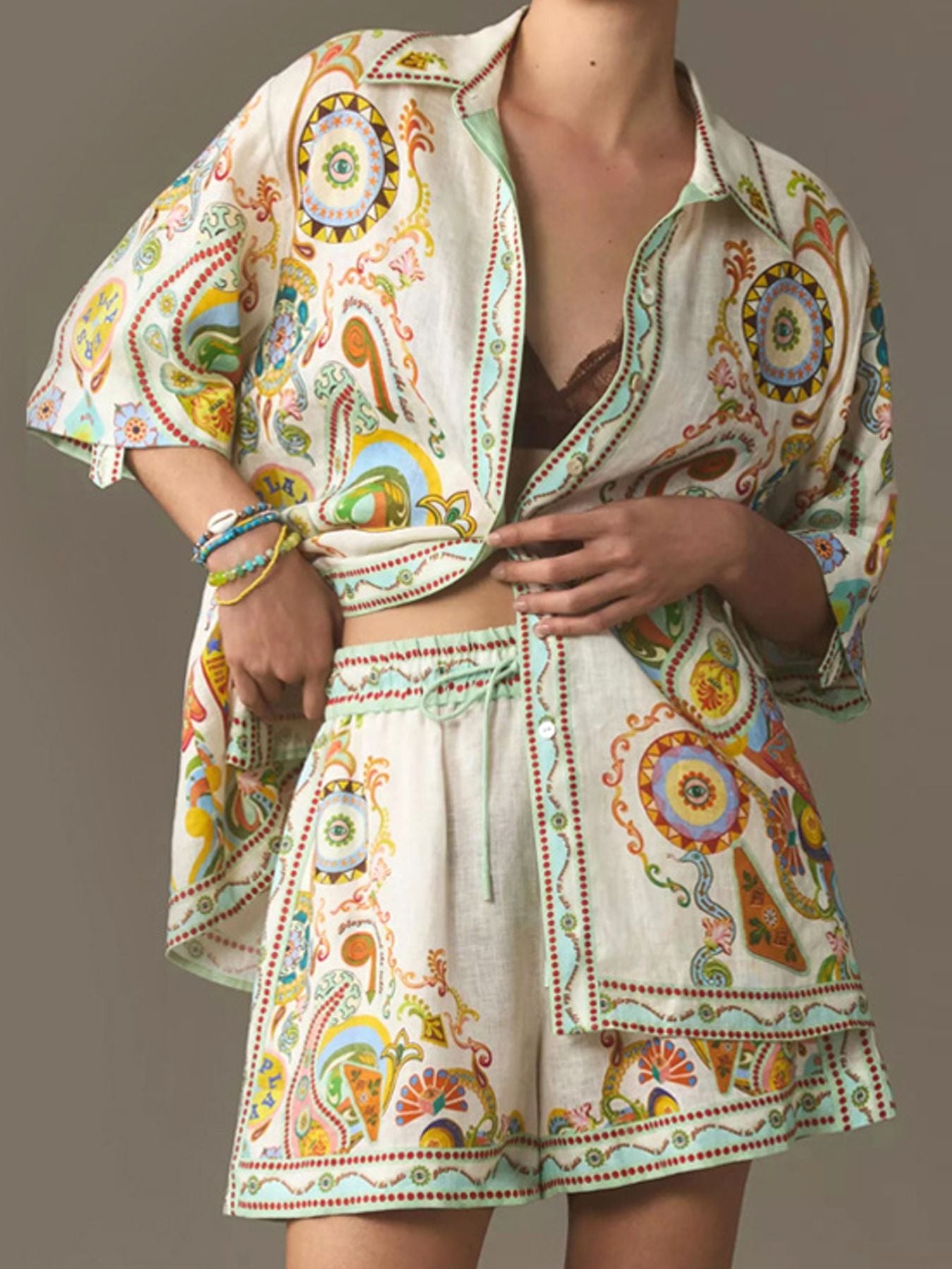 Printed button-up shirt and shorts set by Trendsi, featuring a stylish, coordinated summer outfit in vibrant print.