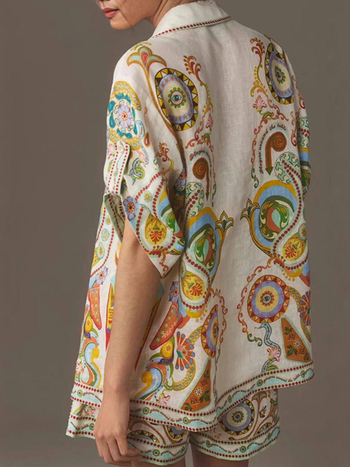 Printed button-up shirt and shorts set by Trendsi featuring a stylish, casual design with vibrant patterns and comfortable fit.