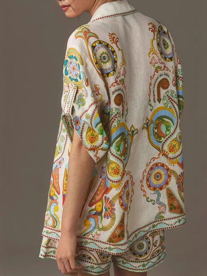 Printed button-up shirt and shorts set by Trendsi featuring a stylish, casual design with vibrant patterns and comfortable fit.