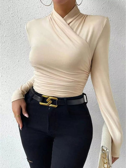 Black ruched long sleeve slim fit top from Trendsi, featuring a fitted design and gathered fabric detail.