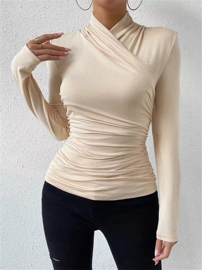 Black ruched long sleeve slim fit top by Trendsi, featuring fitted design and detailed ruching on the sleeves.