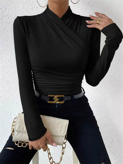 Black ruched long sleeve slim fit top by Trendsi, featuring a fitted design with ruched detailing on the sleeves.