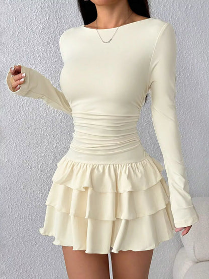 Ruched long sleeve layered ruffle mini dress by Trendsi featuring a stylish, feminine design with ruffled accents and a fitted silhouette.