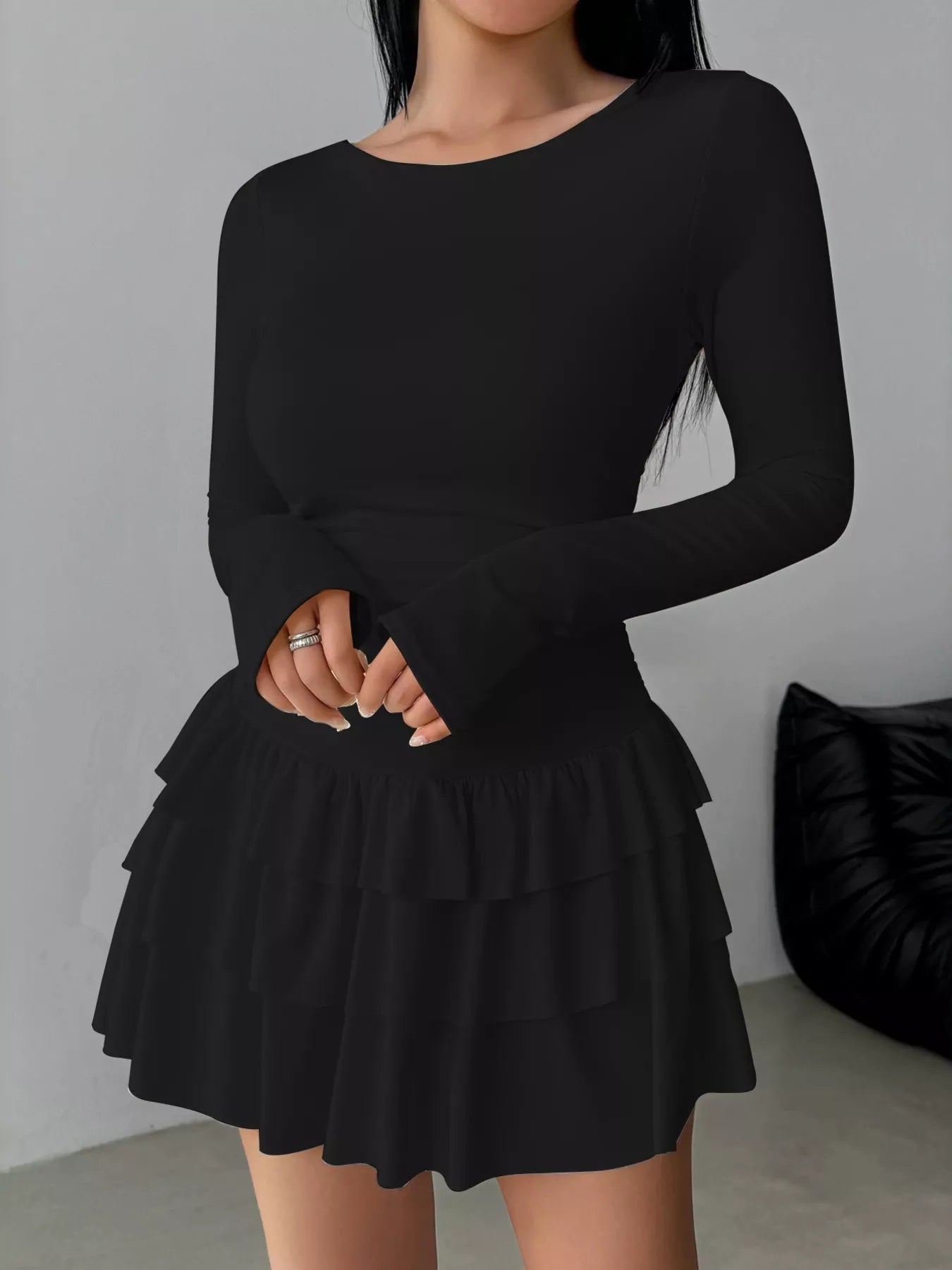 Ruched long sleeve layered ruffle mini dress from Trendsi, featuring a stylish design with ruffles and a fitted silhouette.