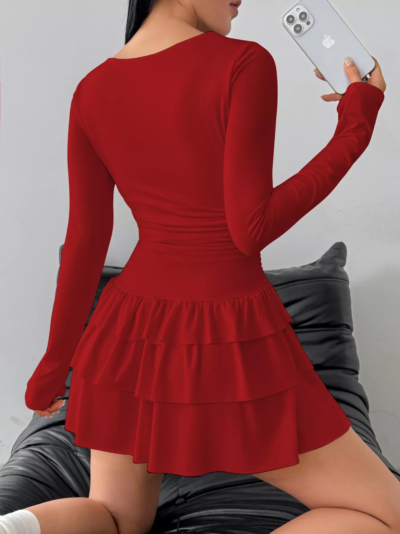 Ruched long sleeve layered ruffle mini dress by Trendsi, featuring a stylish design with ruffles and a fitted silhouette.