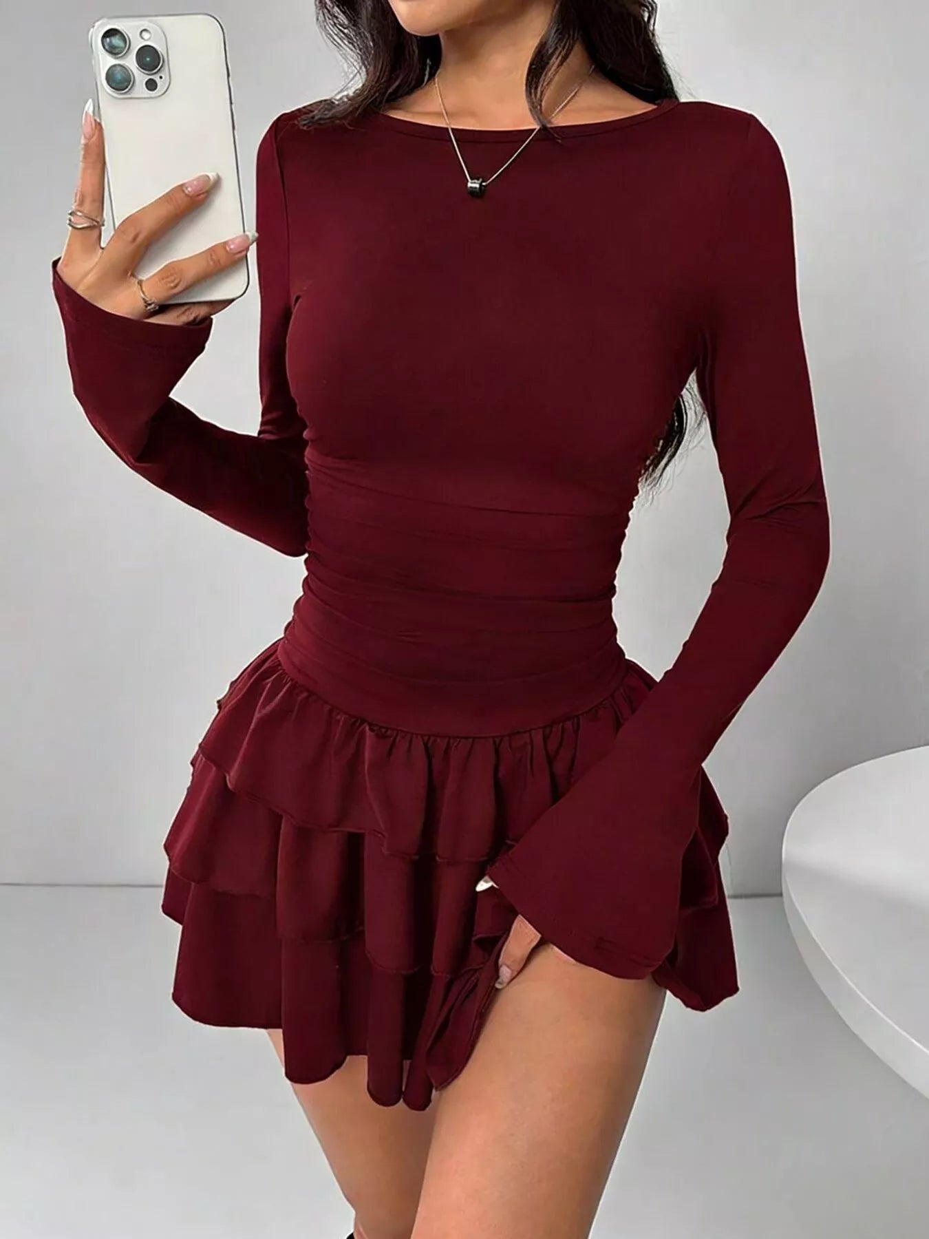 Ruched long sleeve layered ruffle mini dress from Trendsi, featuring a stylish short dress with ruffle details and layered design.