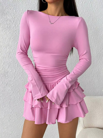 Ruched long sleeve layered ruffle mini dress by Trendsi, featuring a stylish design with ruffles and a fitted silhouette.