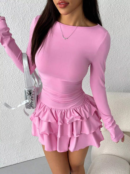 Ruched long sleeve layered ruffle mini dress by Trendsi, featuring a stylish design with ruffle details and a fitted silhouette.