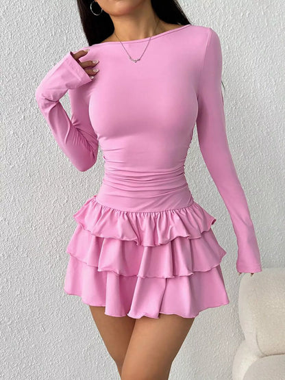 Ruched long sleeve layered ruffle mini dress by Trendsi, showcasing a stylish design with ruffle accents and fitted silhouette.