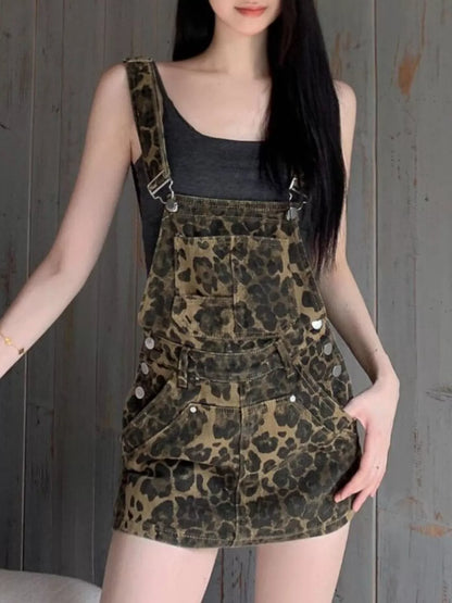Leopard print denim overall dress in army green by Trendsi, featuring adjustable shoulder straps and front pockets.