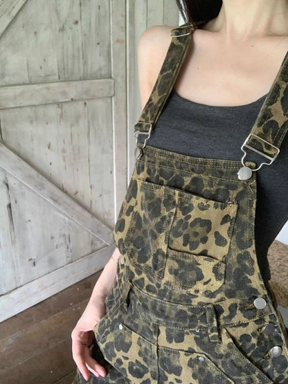 Leopard print denim overall dress by Trendsi featuring adjustable straps and a relaxed fit in army green denim fabric.