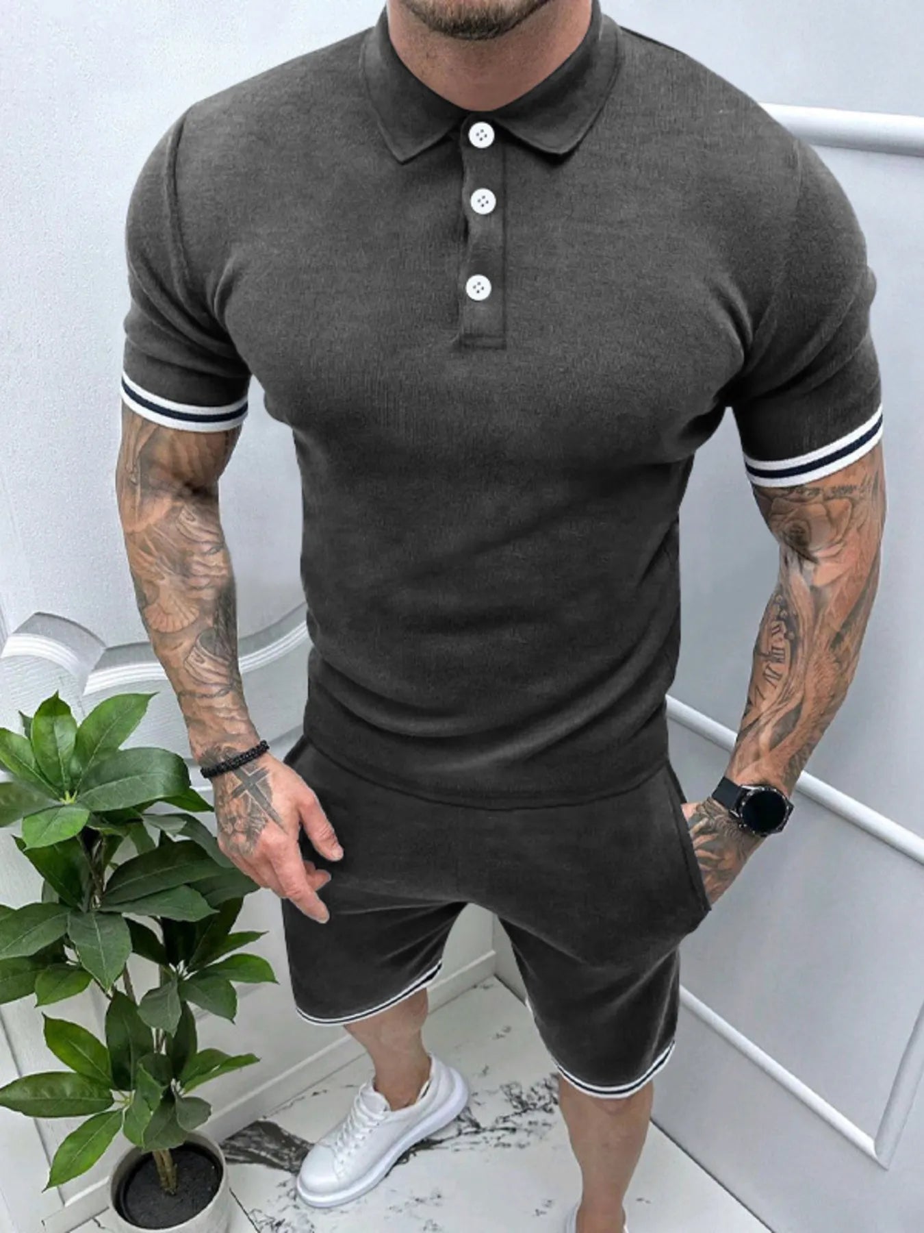 Men's army green short sleeve polo and matching shorts set by Trendsi, displayed on a hanger in a casual summer style.