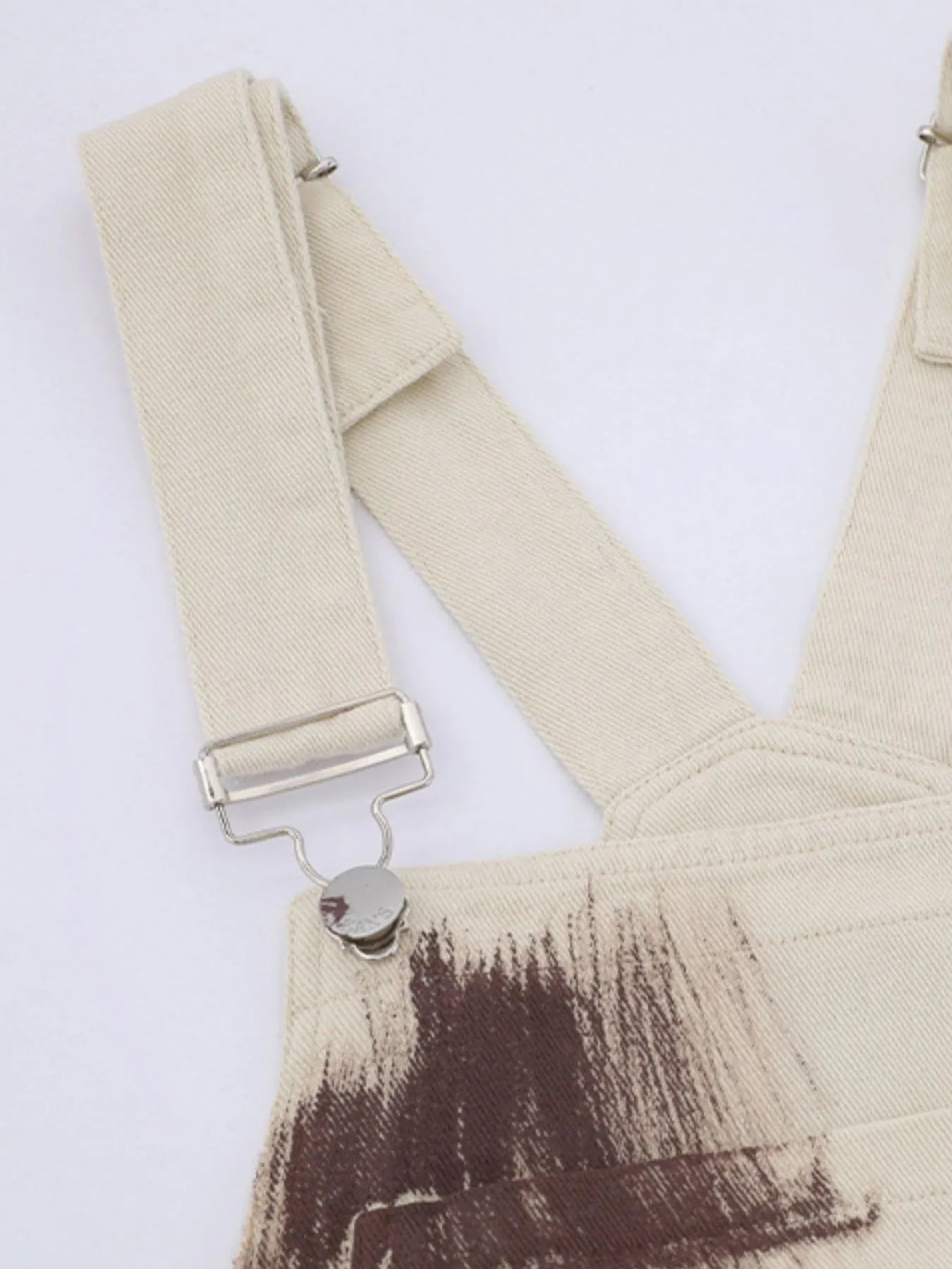 Beige colorful wide-leg overalls from Trendsi featuring a relaxed fit and vibrant design, perfect for casual and stylish outfits.