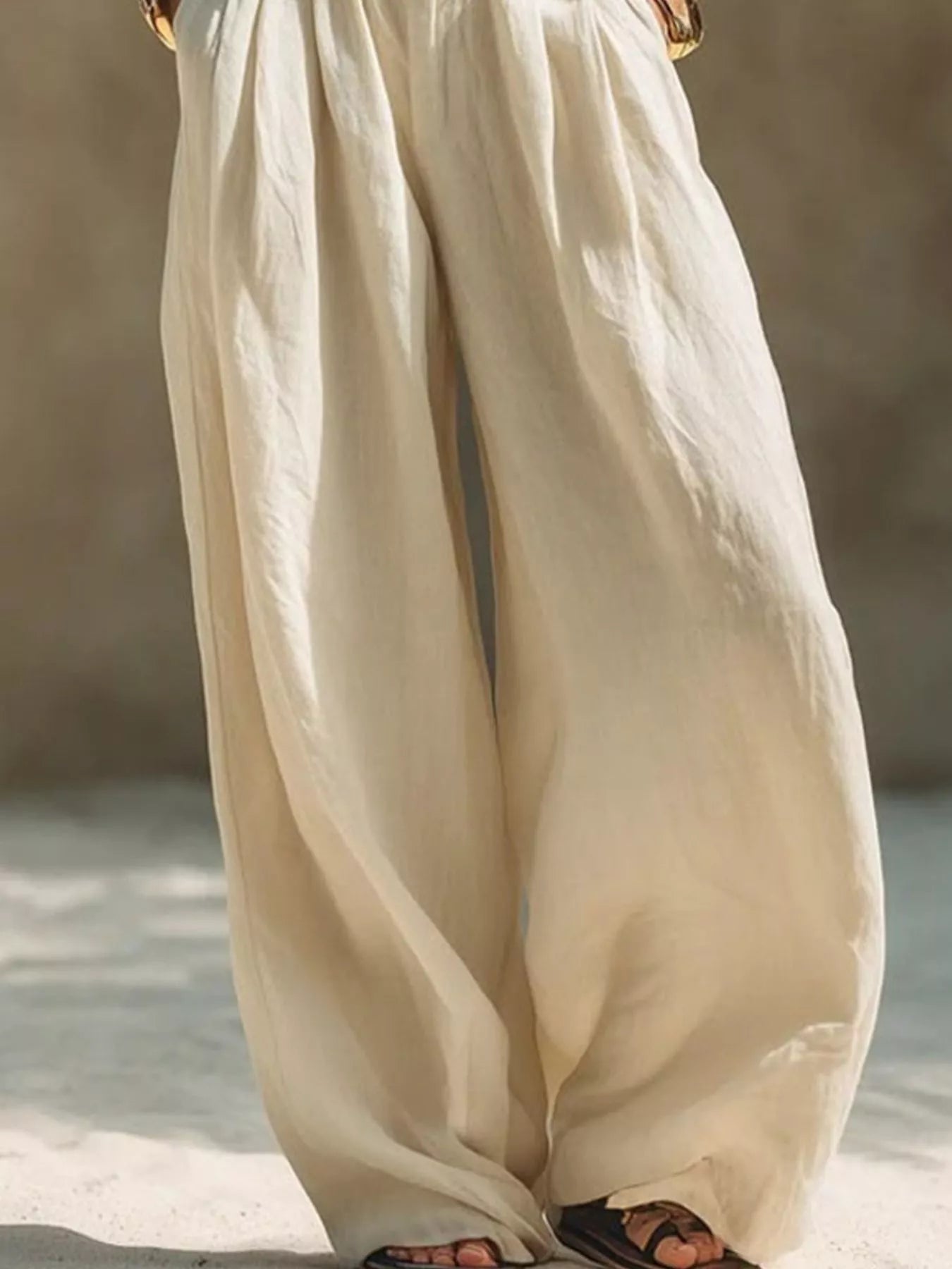 Beige plus size wide-leg pants with full elastic waistband, casual style, by Trendsi, perfect for comfortable everyday wear.