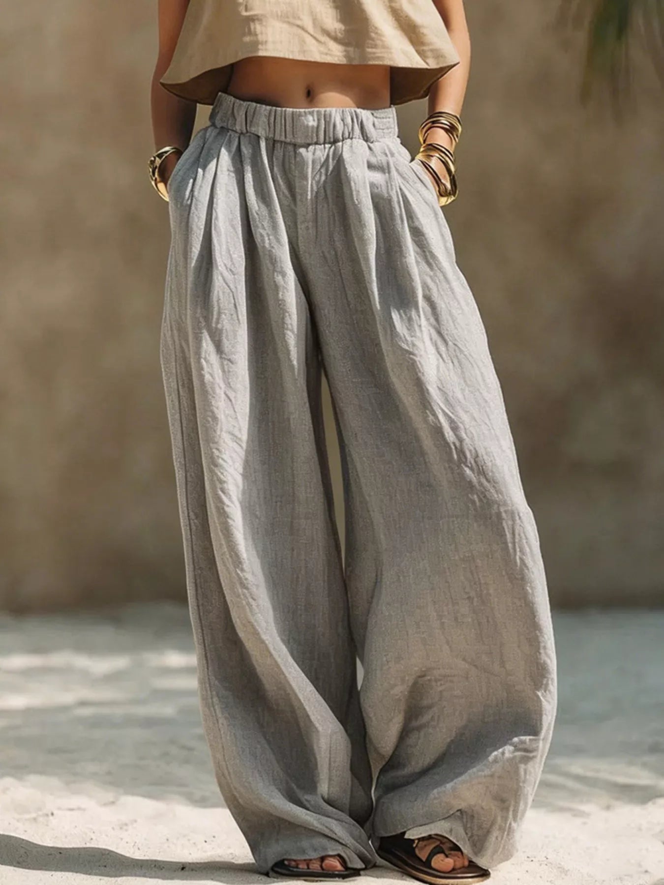 Plus size beige wide leg pants with elastic waistband from Trendsi, full-length, comfortable, and flowy for casual or office wear.