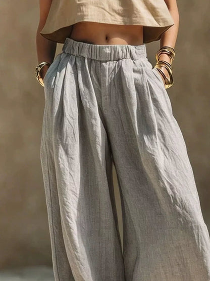 Plus size beige wide-leg pants with elastic waistband from Trendsi, full-length, comfortable and stylish for casual wear