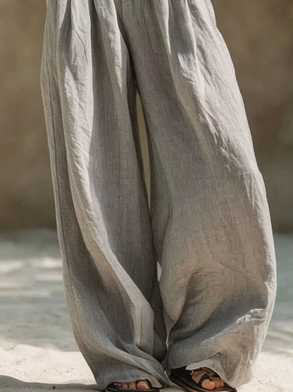 Plus size beige wide-leg pants with full elastic waistband from Trendsi, featuring a relaxed fit and comfortable style.