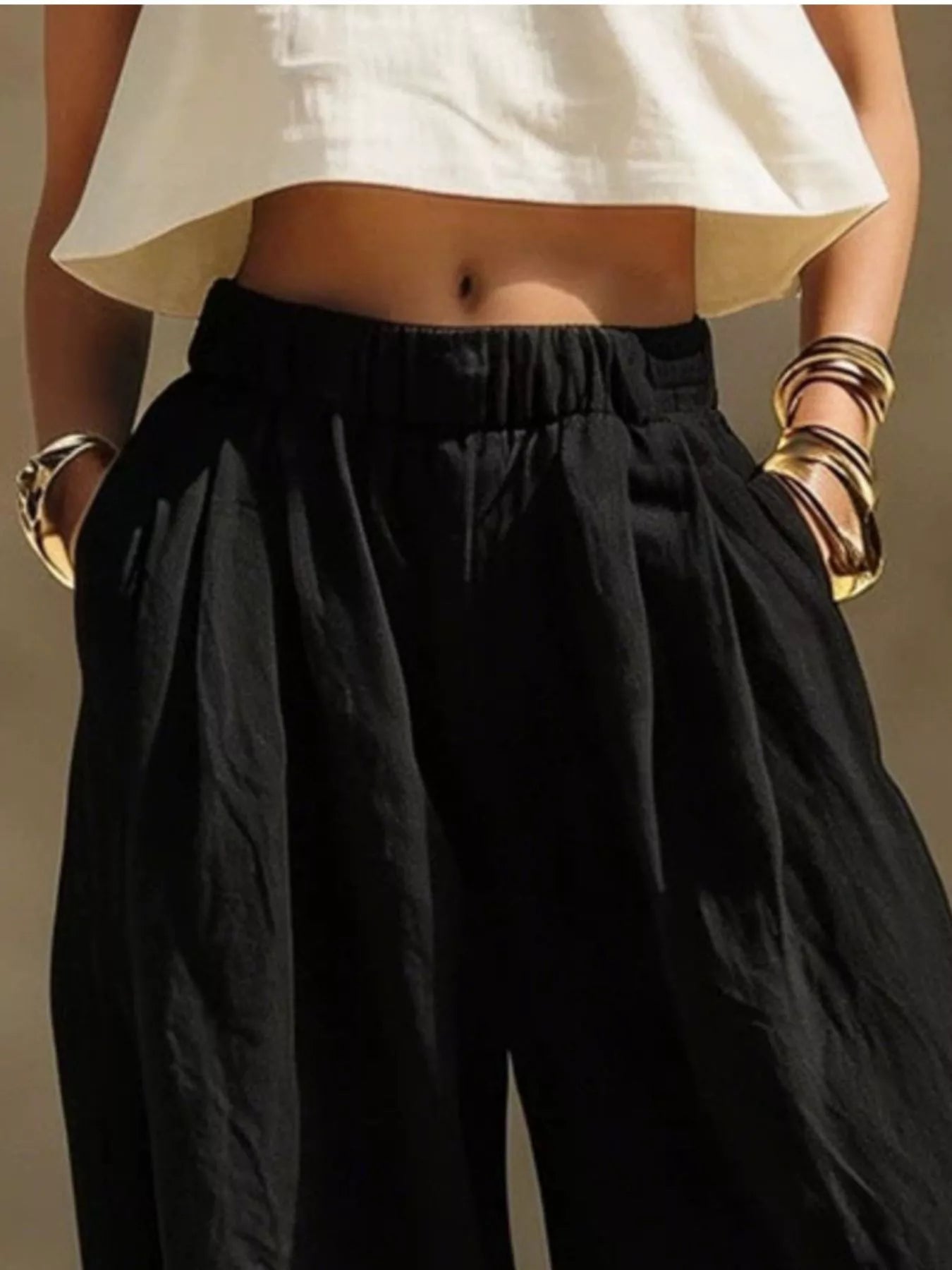 Beige plus size wide leg pants with full elastic waistband from Trendsi, featuring a flowy, comfortable fit and relaxed style.