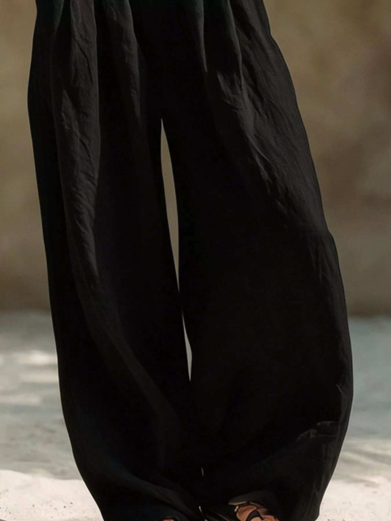 Beige plus size wide-leg pants with full elastic waistband by Trendsi, featuring a relaxed fit and flowy silhouette.