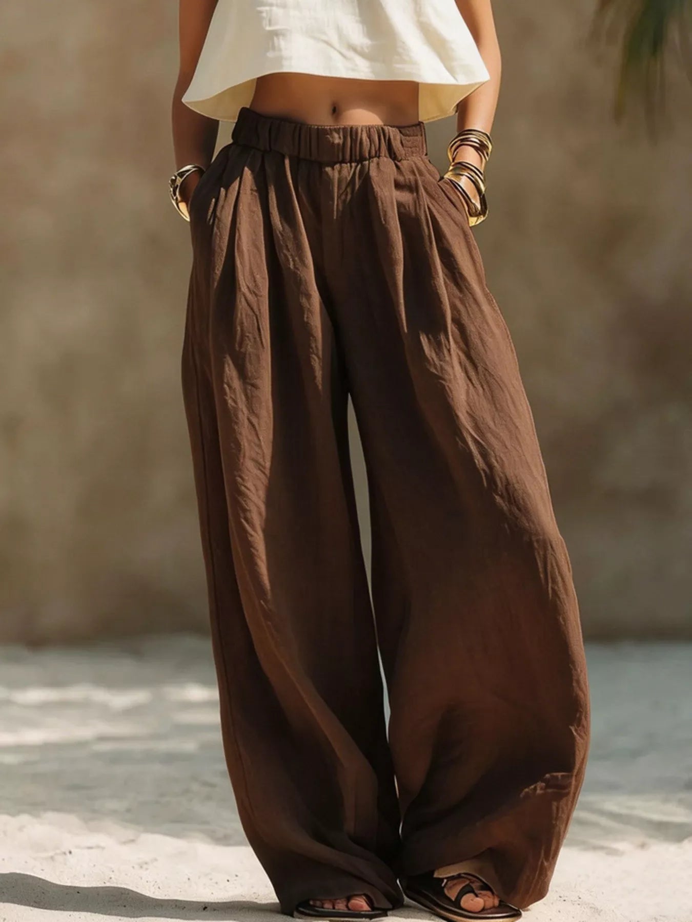 Plus size beige wide-leg pants with full elastic waistband, stylish and comfortable Trendsi brand women's trousers.