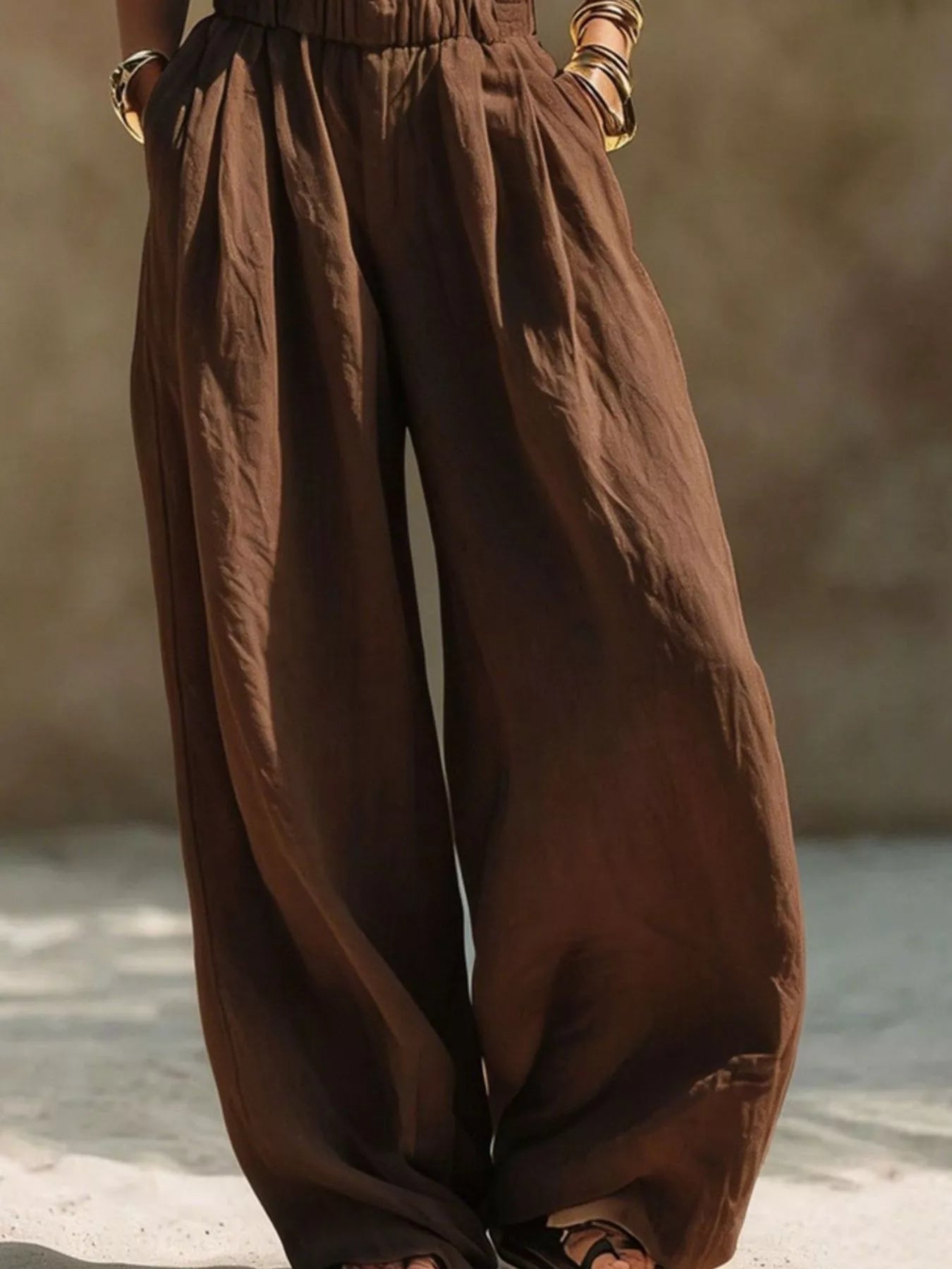 Plus size beige wide leg pants with elastic waistband from Trendsi, full-length, comfortable fit, casual style, and flowy silhouette.