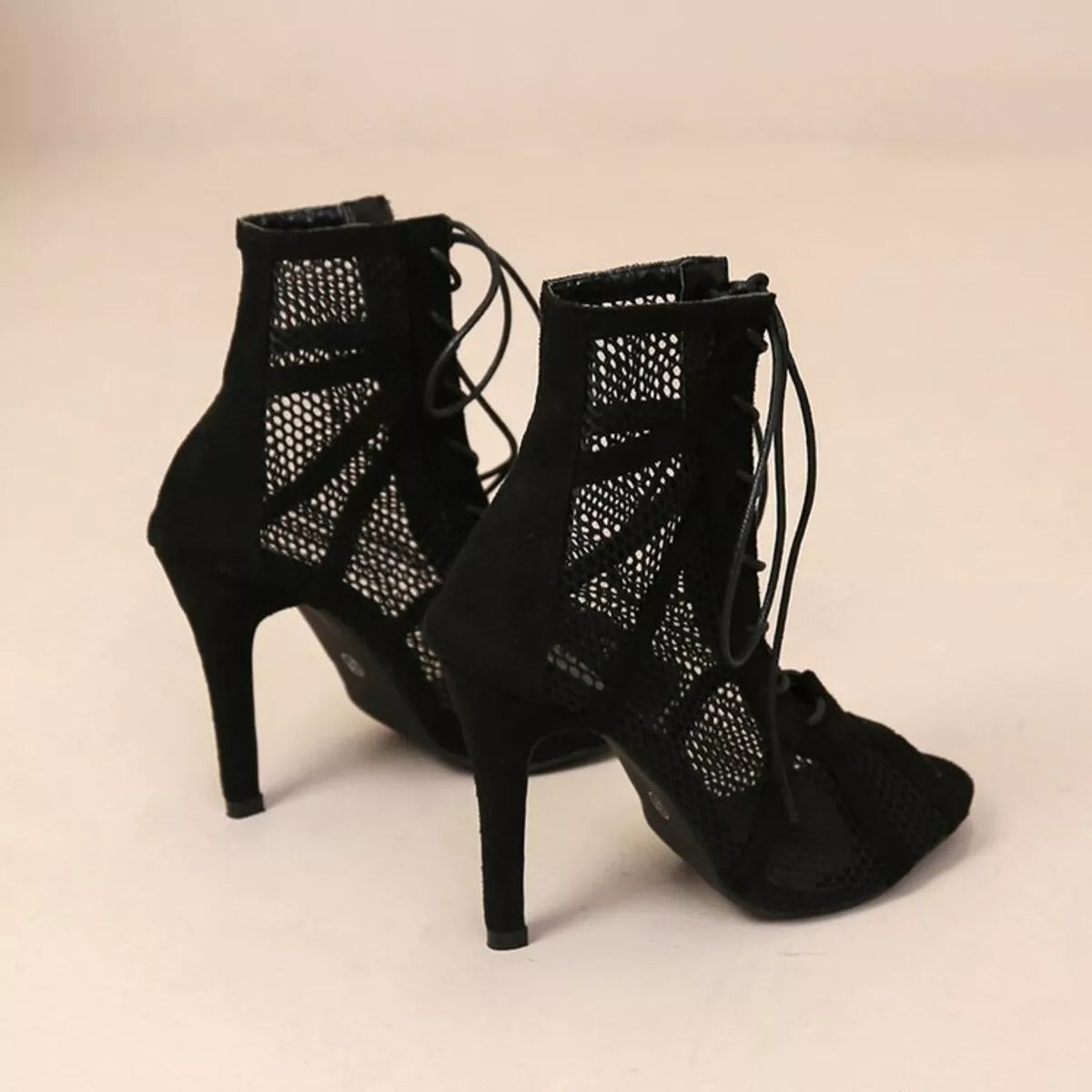 Black mesh lace-up sandals by Trendsi featuring open toe design and stylish ankle ties.
