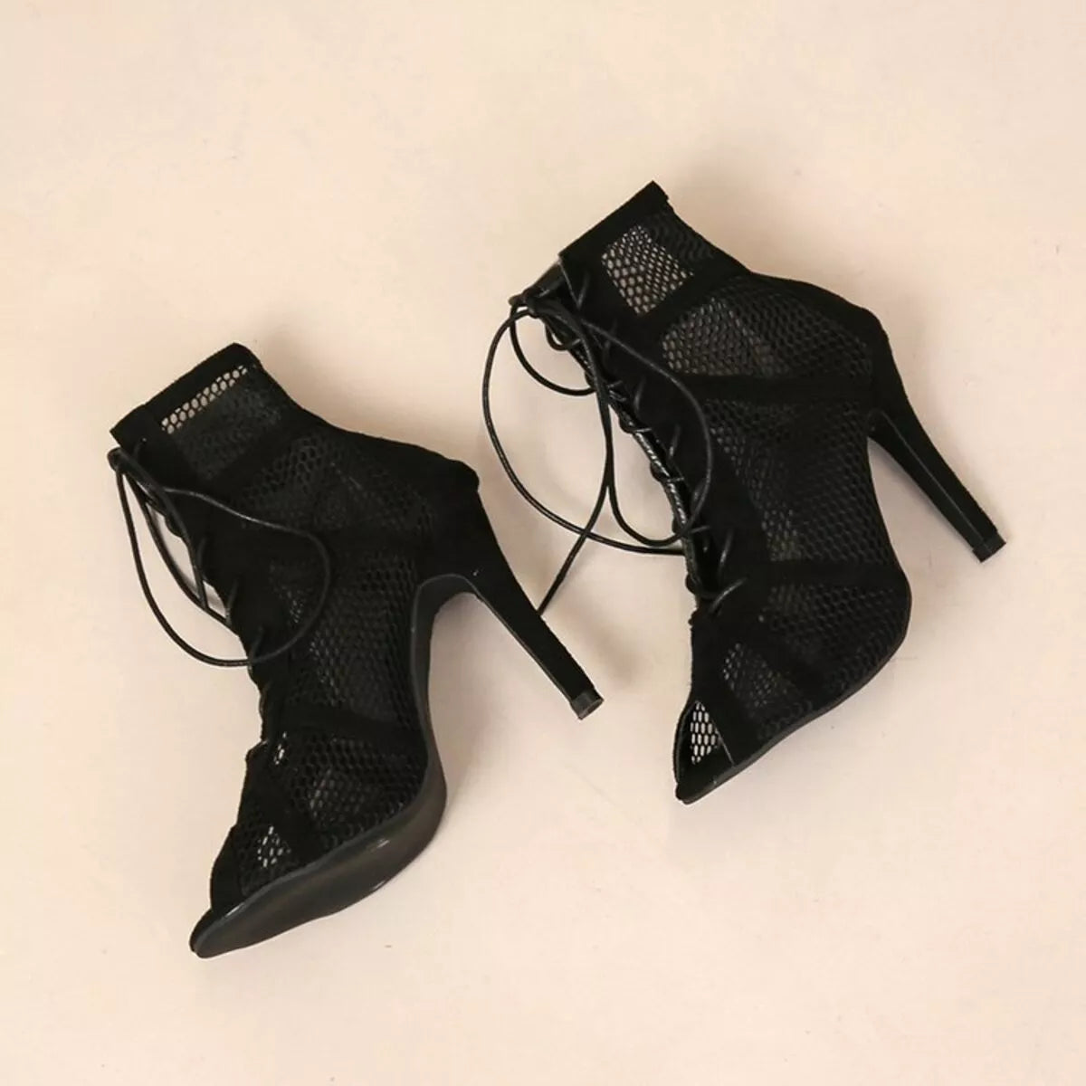 Black mesh lace-up sandals by Trendsi featuring a stylish open-toe design and adjustable lace-up front.