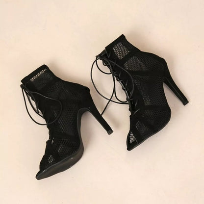 Black mesh lace-up sandals by Trendsi featuring a stylish open-toe design and adjustable lace-up front.