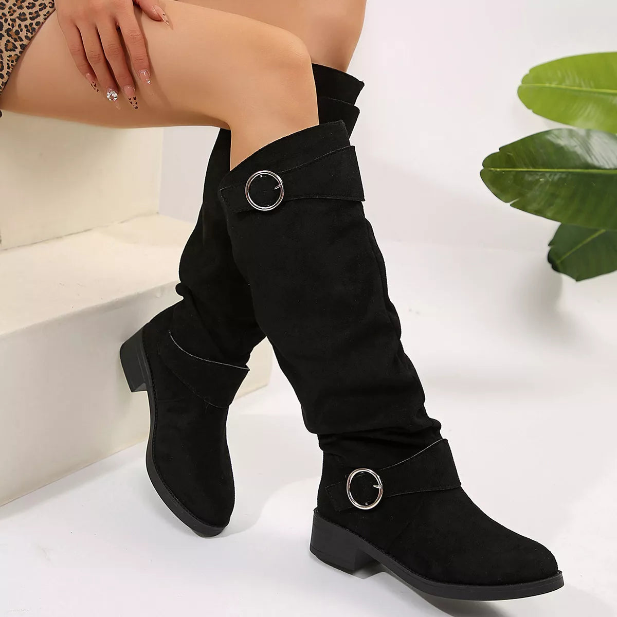 Black block heel boots with buckle detail from Trendsi, featuring a stylish ankle design and sturdy heel.