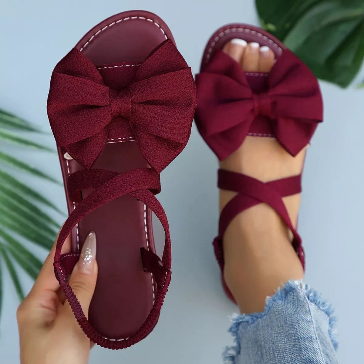 Black Bow Embellished Flat Sandals by Trendsi, showing stylish flat sandals with decorative bows and comfortable design.