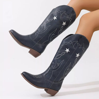 Black Western Star embroidered cowboy boots with intricate stitching and pointed toe, designed for Western style footwear.