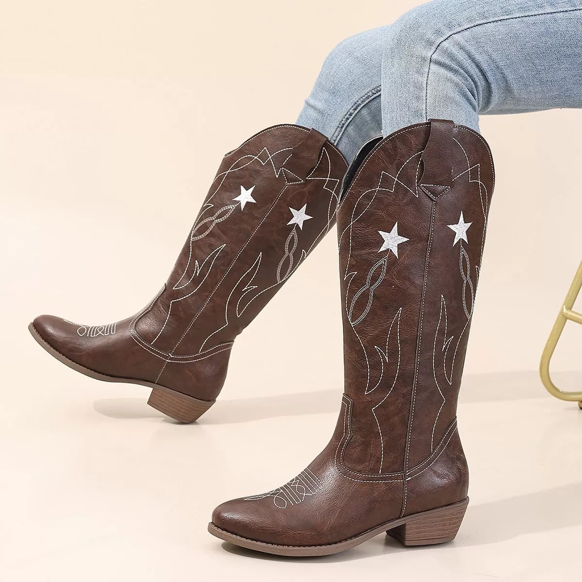 Black Western Star embroidered cowboy boots with intricate stitching and pointed toes, stylish Western footwear by Trendsi.