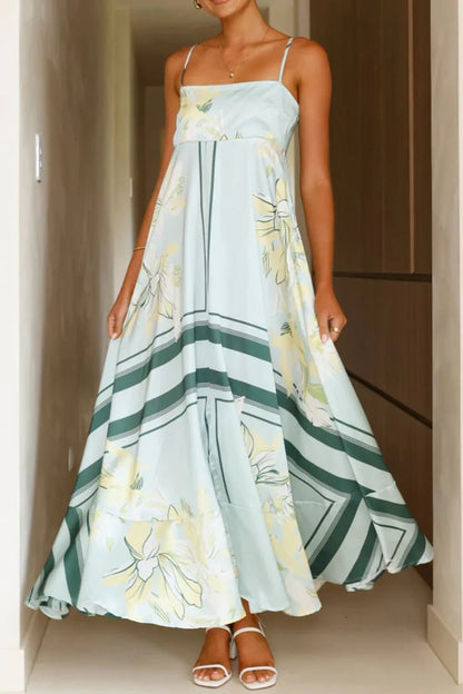 Printed square neck cami maxi dress from Trendsi featuring a flowy design and square neckline in a vibrant print.