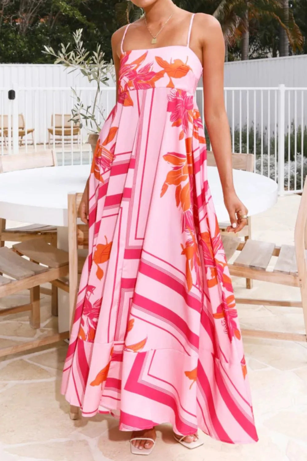 Printed square neck cami maxi dress by Trendsi featuring a flowy silhouette, floral print, and square neckline.