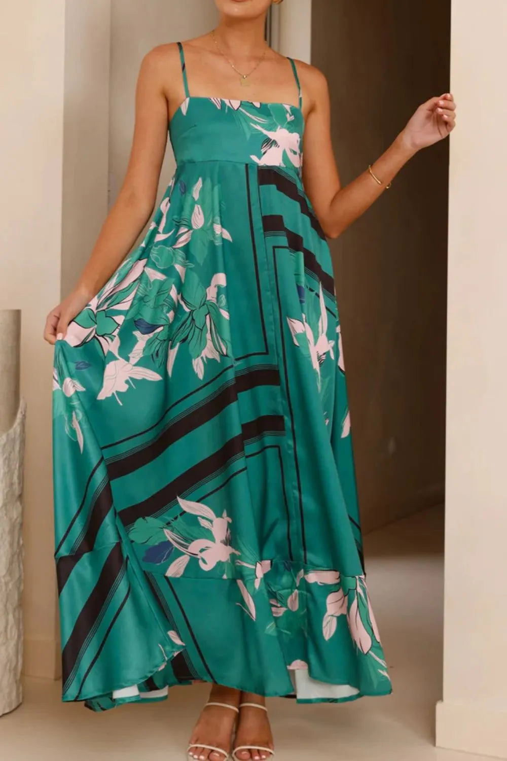 Printed square neck cami maxi dress from Trendsi featuring a flowy silhouette and vibrant floral pattern.