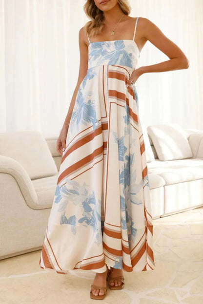 Printed square neck cami maxi dress by Trendsi, featuring a flowing silhouette, square neckline, and vibrant floral pattern.