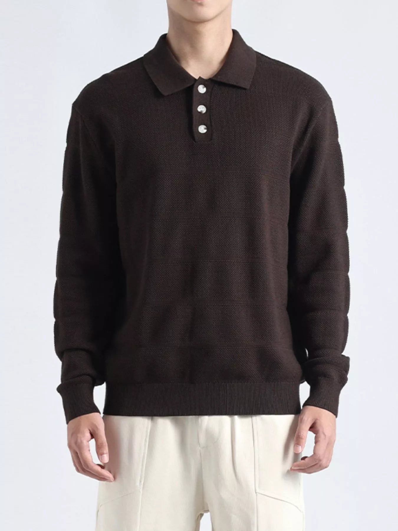 Plus size men's long sleeve knit top with button details in black, featuring a comfortable, stylish design.