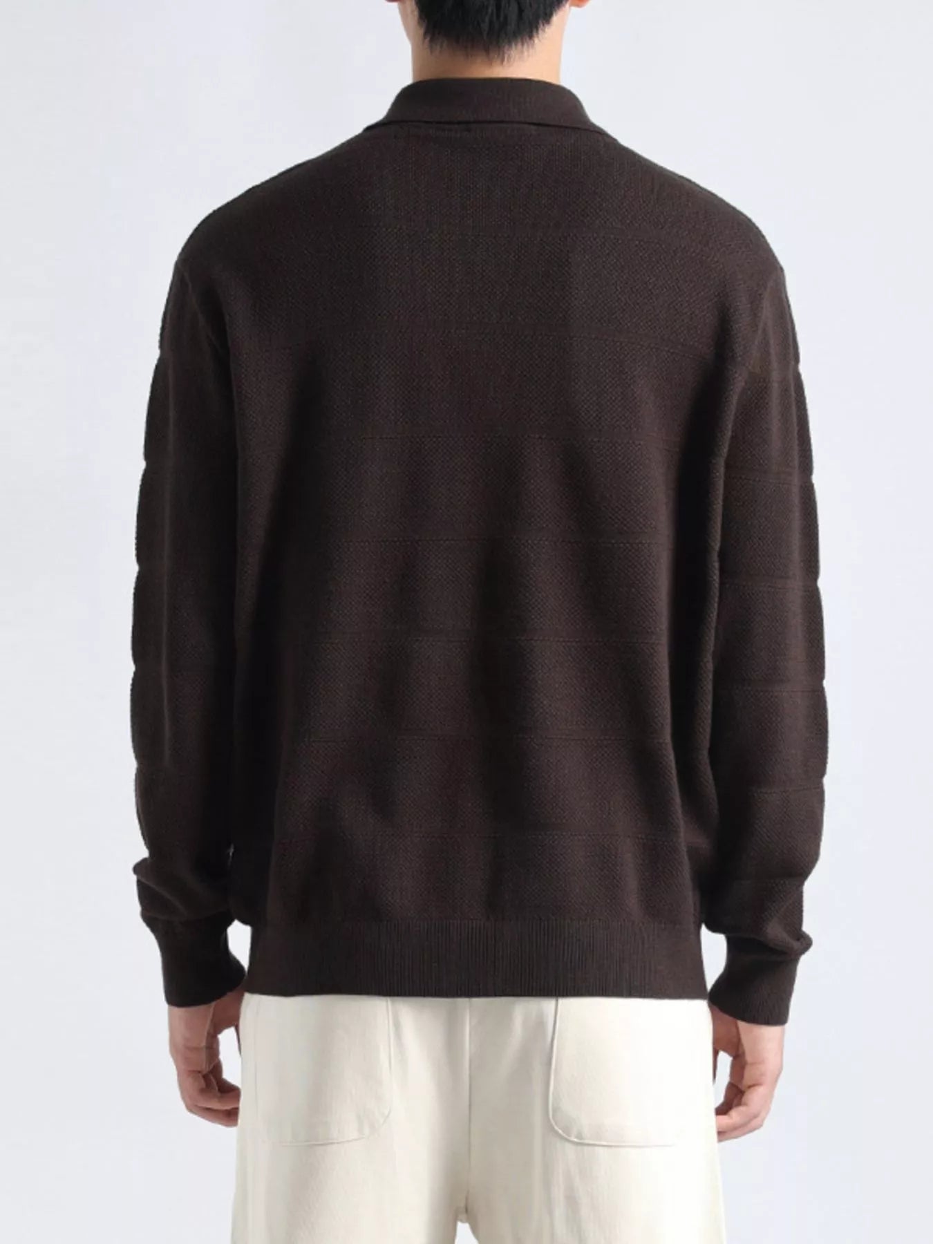 Plus size men's long sleeve knit top with button details, black color, from Trendsi, shown on a male model.