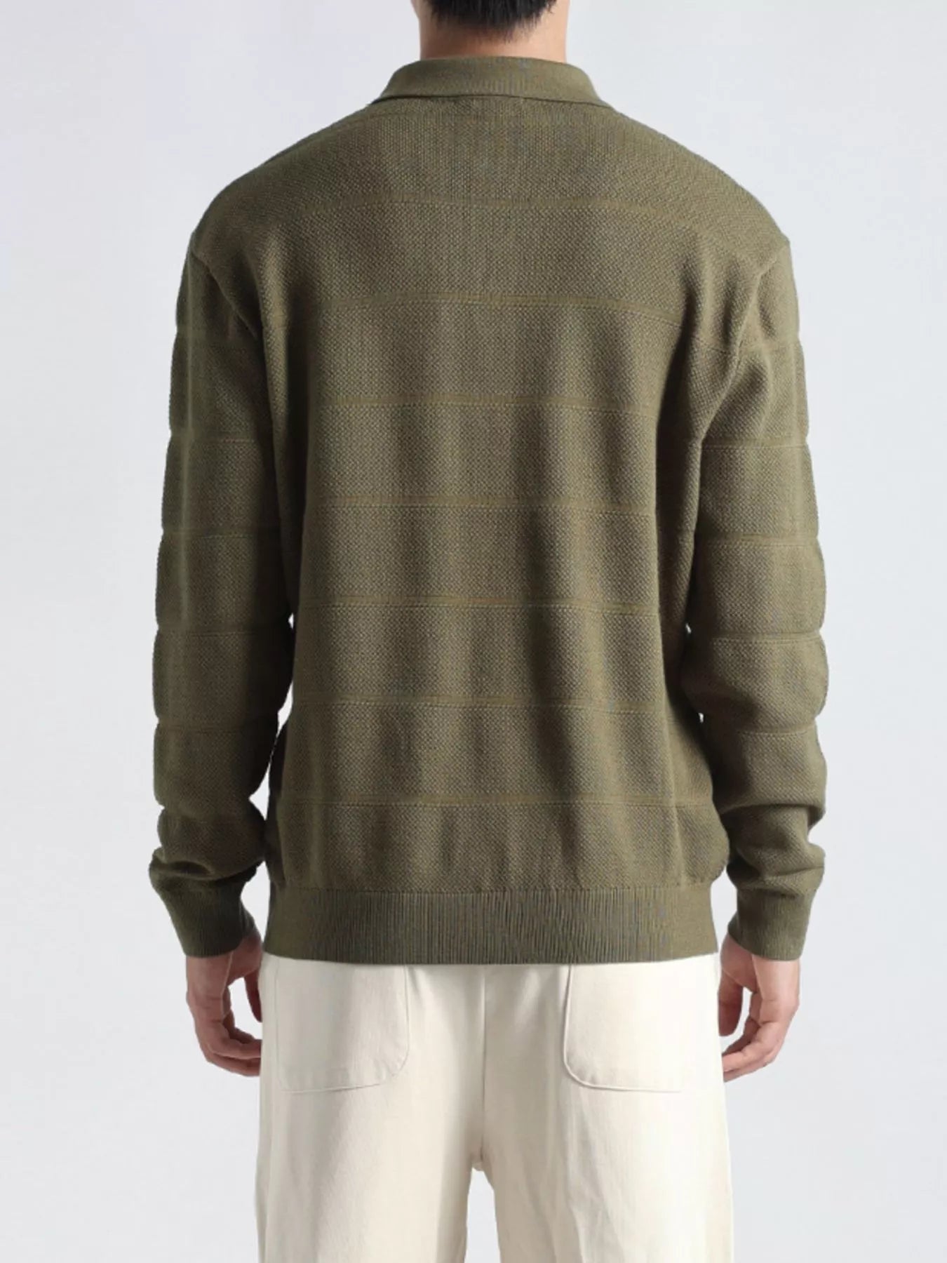 Plus size men's black long sleeve knit top with button details, stylish and comfortable, by Trendsi.
