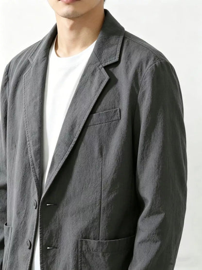 Plus size men's black button-up long sleeve blazer by Trendsi, tailored fit with classic lapel and stylish design.