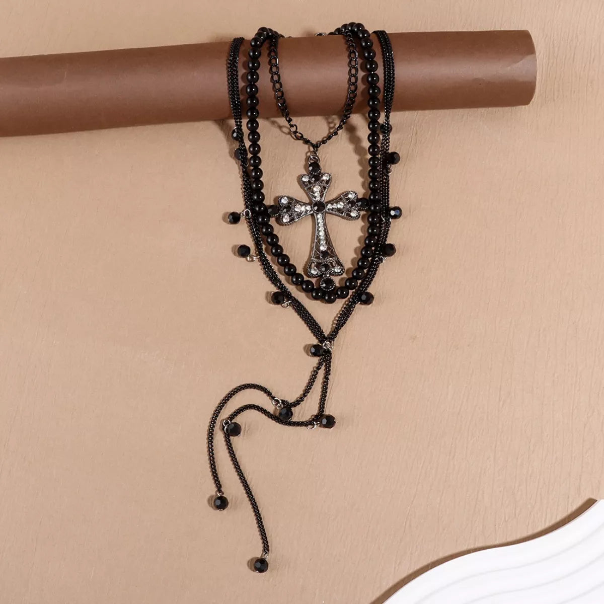 Three-piece pearl cross pendant necklace set by Trendsi, featuring elegant pearl and cross pendant designs on matching chains.