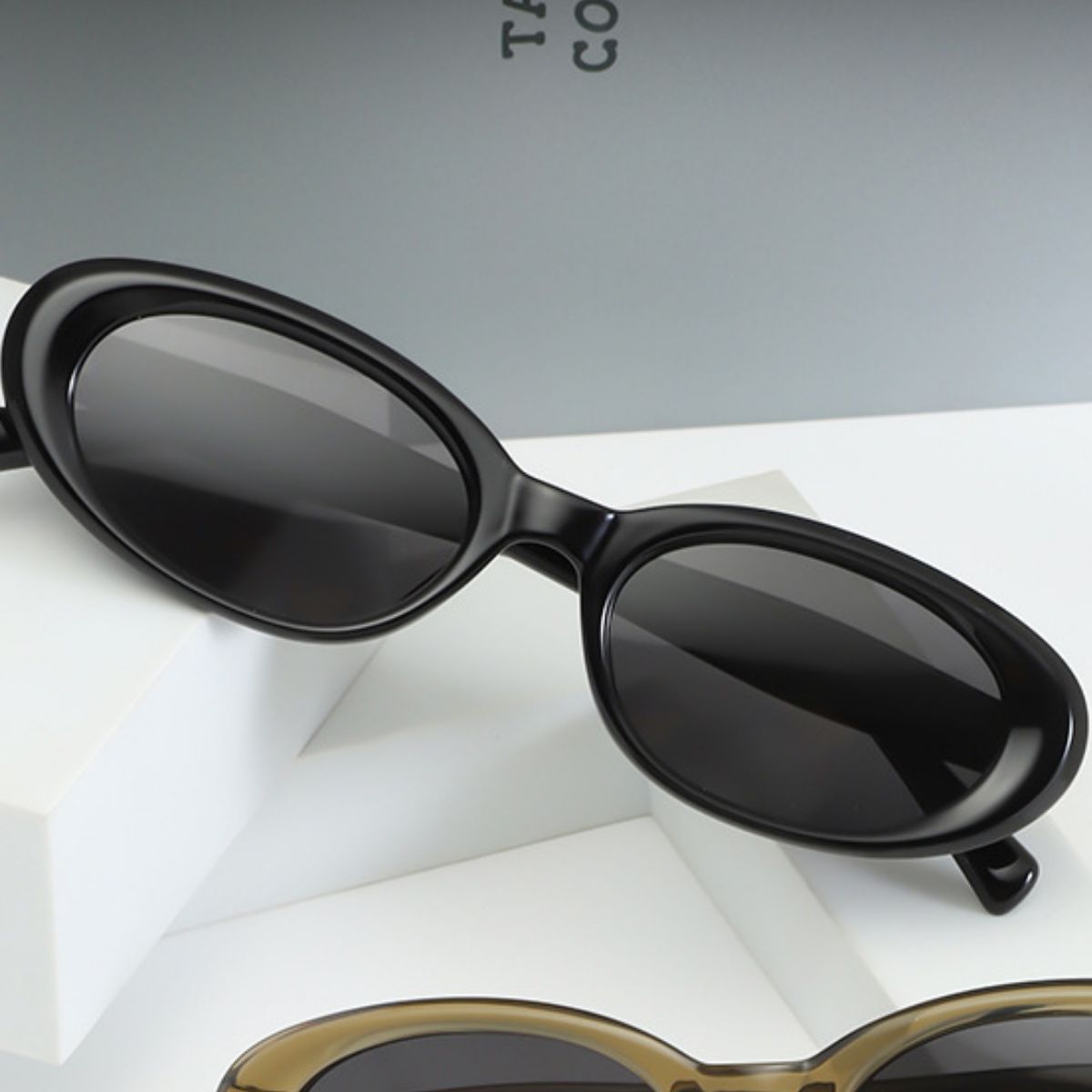 Trendsi UV protection oval sunglasses with dark tinted lenses and sleek black frame, stylish eyewear for sun protection