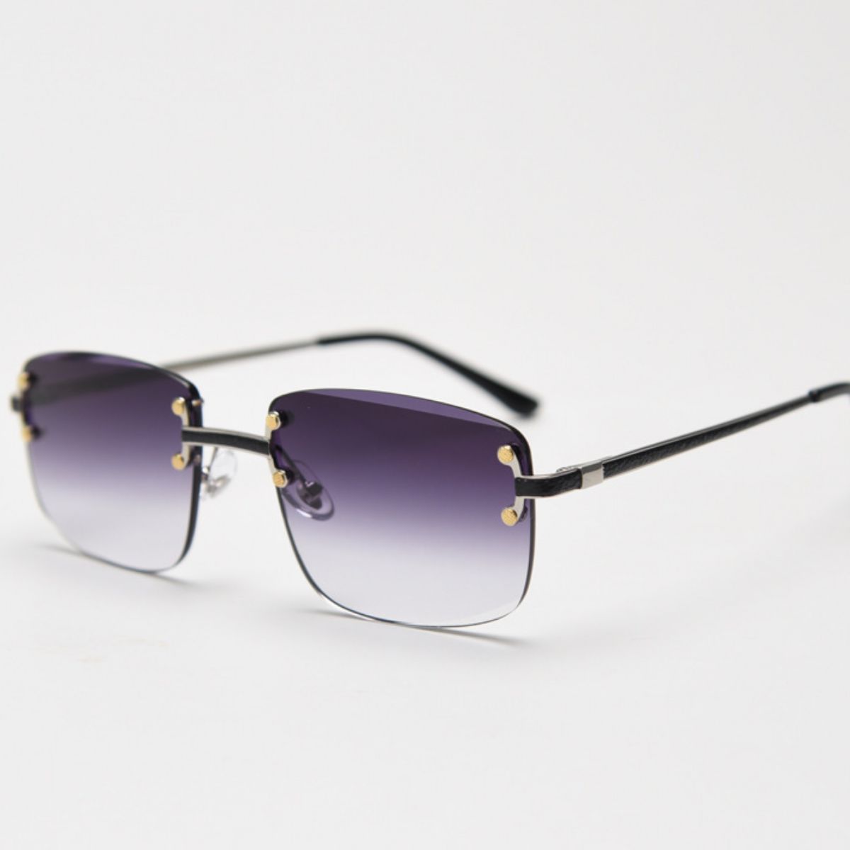 Rimless gradient tinted sunglasses by Trendsi with sleek, modern design and gradient lenses in a natural outdoor setting