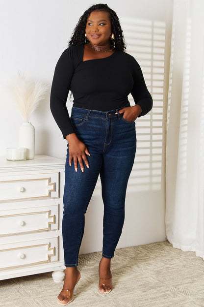 Black Basic Bae asymmetrical neck long sleeve top by Trendsi, showcasing its stylish neckline and fitted design.
