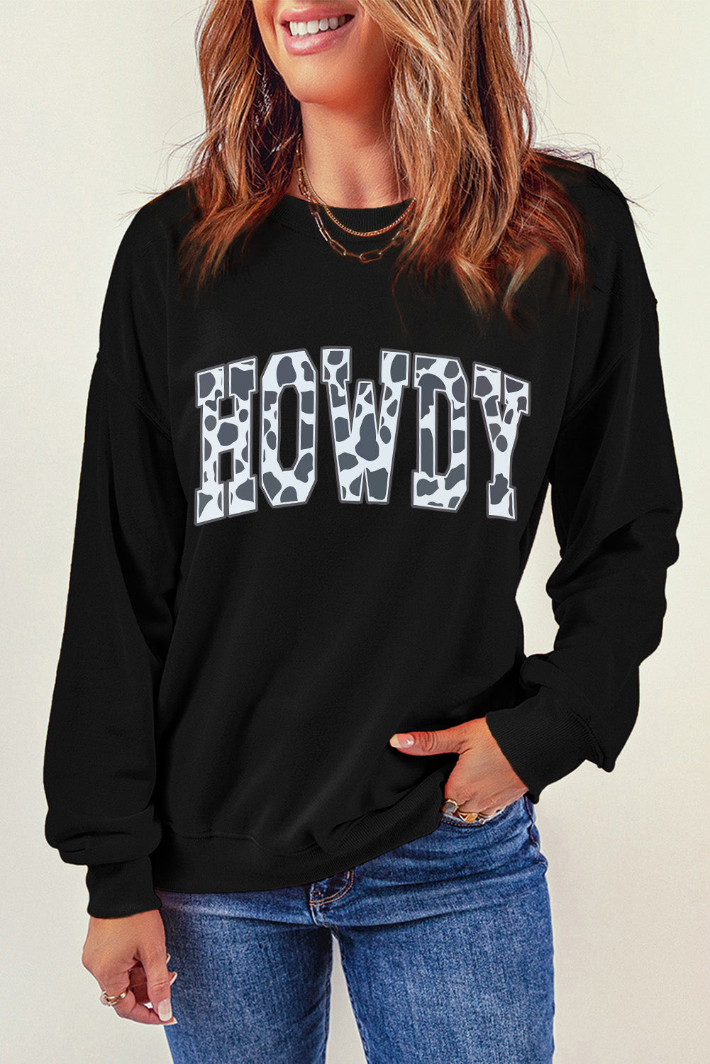 Black Trendsi casual long sleeve sweatshirt with a round neck and a cheerful "Howdy" graphic design.